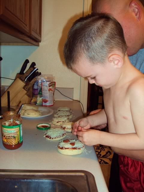 Matty helping Matt Make mini english muffin pizza's